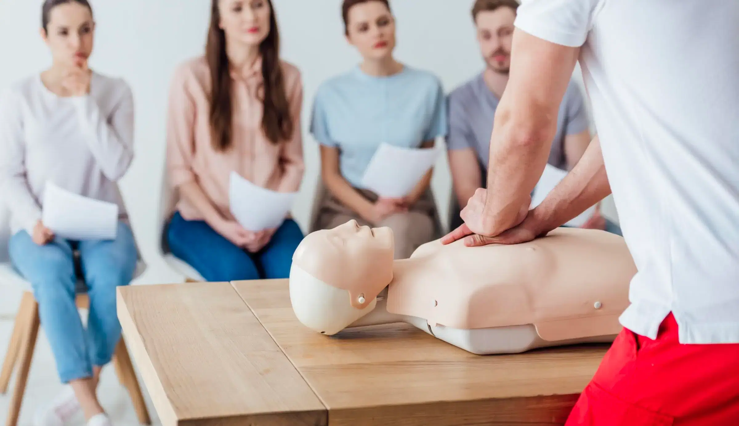 CPR training with manikins and practice equipment